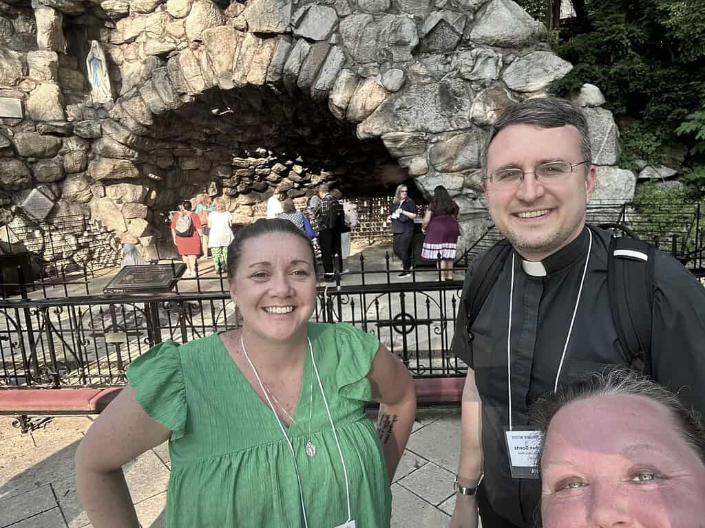 Dr. Jacobsen, Father Jonathan, and Mrs. Topich at the grotto of Our Lady of Lourdes at the University of Notre Dame